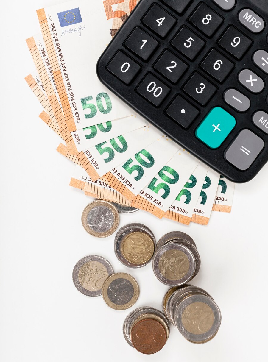 bank-notes-coins-with-calculator_23-2148546916 (1)
